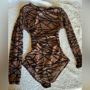 Transparency body suit. Light brown/transparent with black lines. Size: S/M.